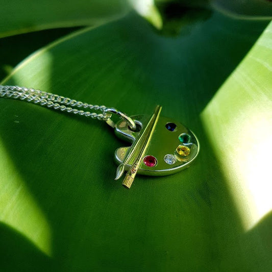 paint palette with gemstones in silver