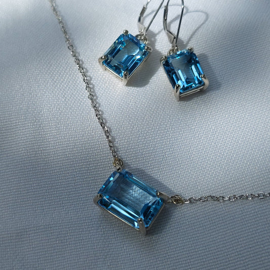Blue topaz earring and necklace set in 14k white gold